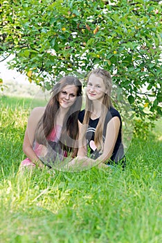Girls in an apple orchard