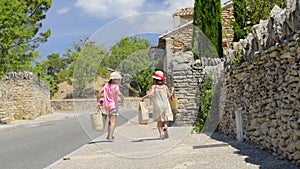 Girls arriving from market in Provence photo