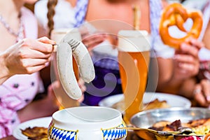 Girls in Bavarian Restaurant having breakfast