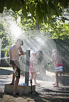 Girls and boy and hydrant fun
