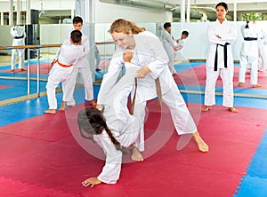 Girls and boys on aikido training