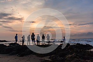 Girls Boys Family Silhouetted Beach Ocean Sunrise