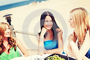 Girls in cafe on the beach