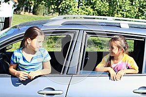 Girls in car windows