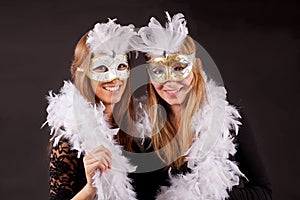 Girls carnaval mask and feathers photo