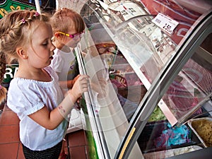 Girls choosing ice cream flavour