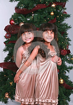 Girls by Christmas Tree photo