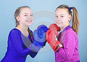 Girls cute boxers on blue background. Friendship as battle and competition. Pass boxing challenge. Test for fortitude