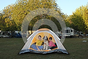 Girls and Dog in a Tent While Camping