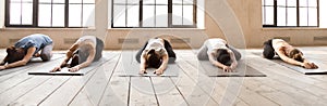 Girls doing Child Pose during yoga session