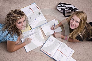 Girls doing homework looking up