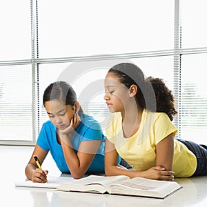 Girls doing schoolwork.