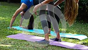 girls doing yoga outdoors chakrasana