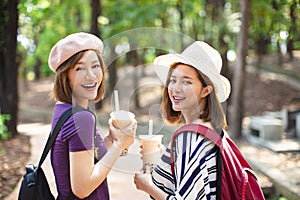 girls drinking bubble tea and enjoy summer vacation