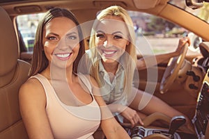 Girls driving the car
