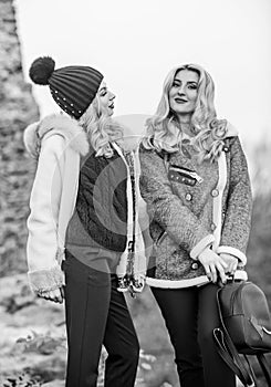 girls enjoy free time together. women in tweed jacket and half-length coat. warm clothes in fall. sexy women nature