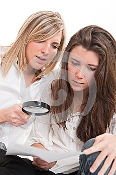 Girls examining document