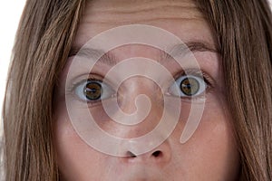 Girls eye and nose against white background