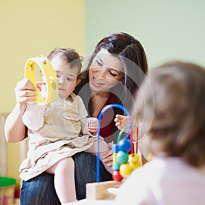 Girls and female teacher in kindergarten