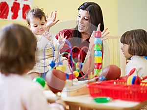 Girls and female teacher in kindergarten