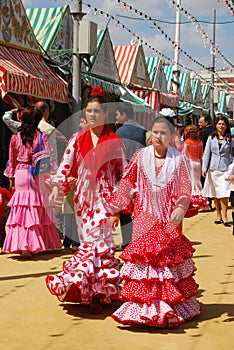 Girls in flamenco dresses at the Seville Fair.