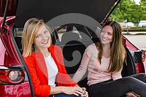 Girls fool around in car in anticipation of trip