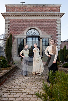 Girls in front of a Vitorian mansion