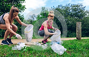 Girls with garbage bag doing plogging