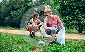 Girls with garbage bag doing plogging