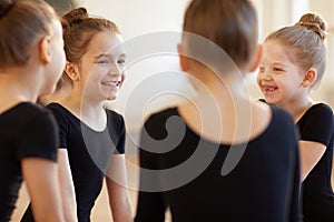 Girls Giggling in Dance Class