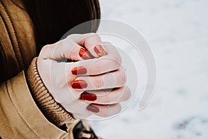 Girls hands in cold winter