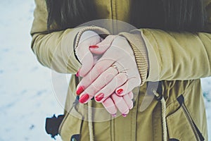 Girls hands in cold in winter day