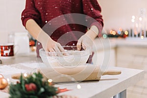 Girls hands kneading dough for Christmas cookies