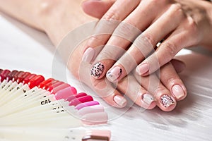 Girls hands with natural color manicure.