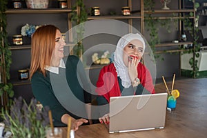 Girls hanging out and typing on laptop and relaxing