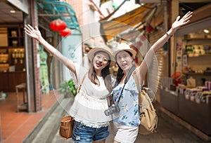 Girls happy visiting Jiufen town of Taiwan.