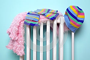 Girls hat scarf and gloves drying on a radiator