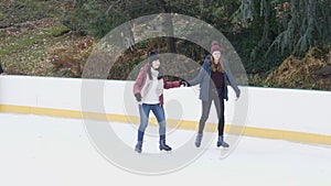 Girls have a lot of fun doing ice skating in New Yorks Central Park