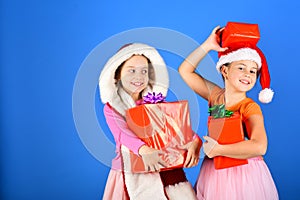 Girls have winter holidays, copy space. Sisters in Santa hats