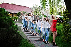 Girls having fun while posing outside in the park on the bachelorette party