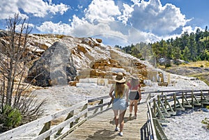 Girls hinkg on summer vacation in Yellowstone National Park
