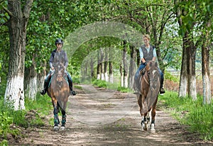 Girls on horseback riding