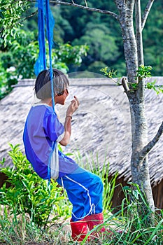 Girls of joy on his swing,Tribal girls are on the mountain of joy on his swing.