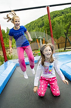 Girls Jumping on Trampoline