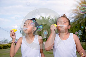 Girls kid happiness funny soap bubble in the park ,Laughing happy wi