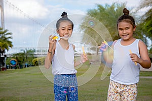 Girls kid happiness funny soap bubble in the park ,Laughing happy wi