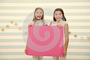 Girls kids hold advertisement poster copy space. Children hold advertising banner. Happy children with blank paper for