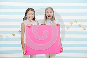 Girls kids hold advertisement poster copy space. Children hold advertising banner. Happy children with blank paper for