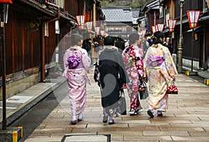 Girls in kimano on the street Higashi Chaya District in Kanazawa, Japan