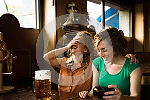 Girls laughing at the pub